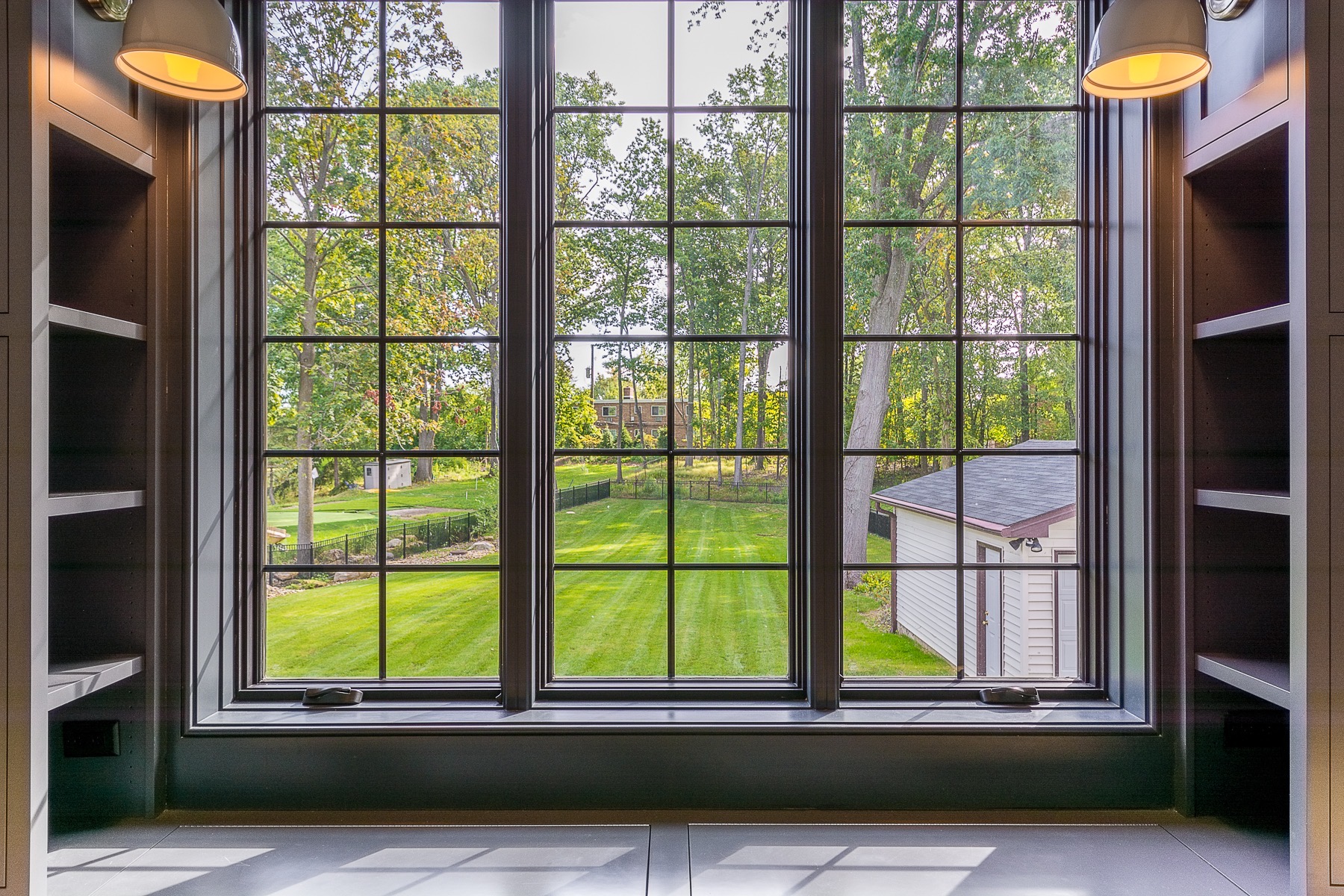 evergreen-portfolio-rocky-river-farmhouse-interior-exterior-window-backyard